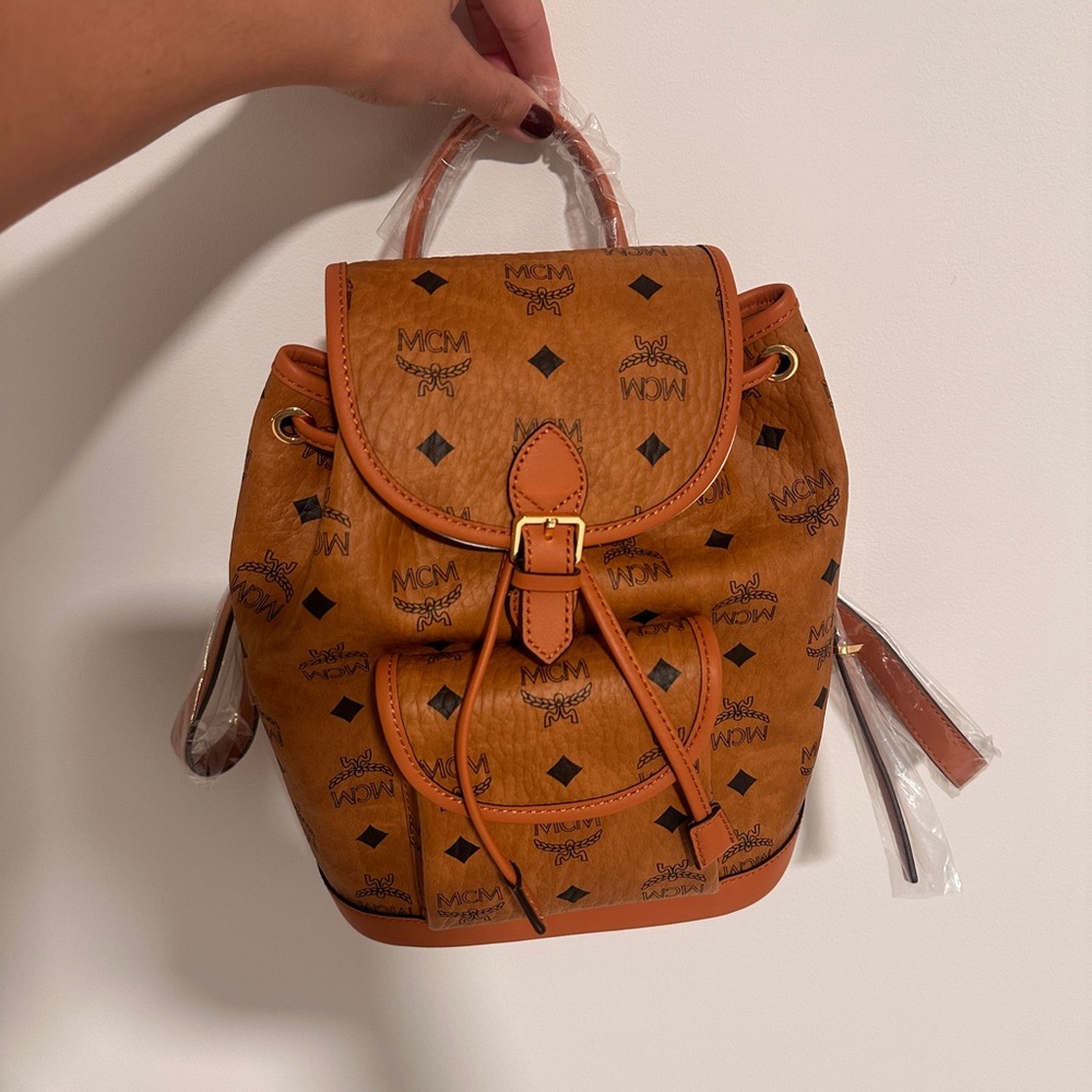 MCM 

Iconic logo mini aren backpack with adjustable strap